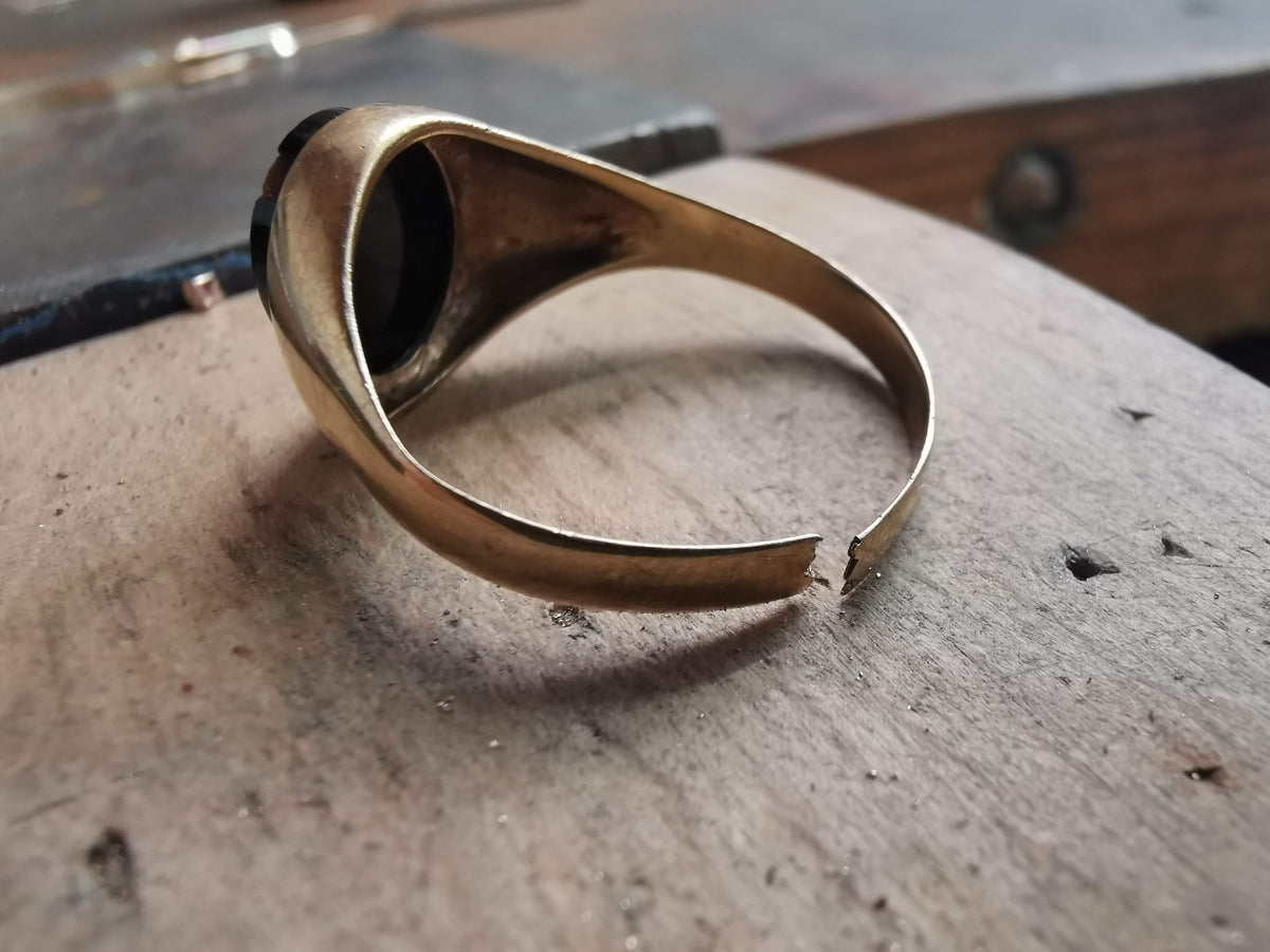 Gold ring on a textured surface