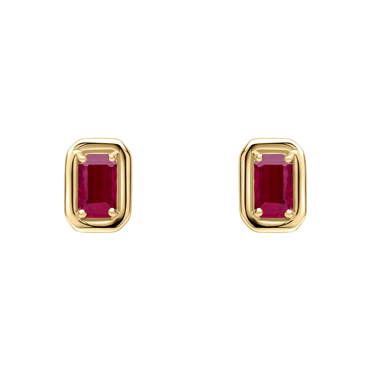 Gold earrings with red gemstones on a white background