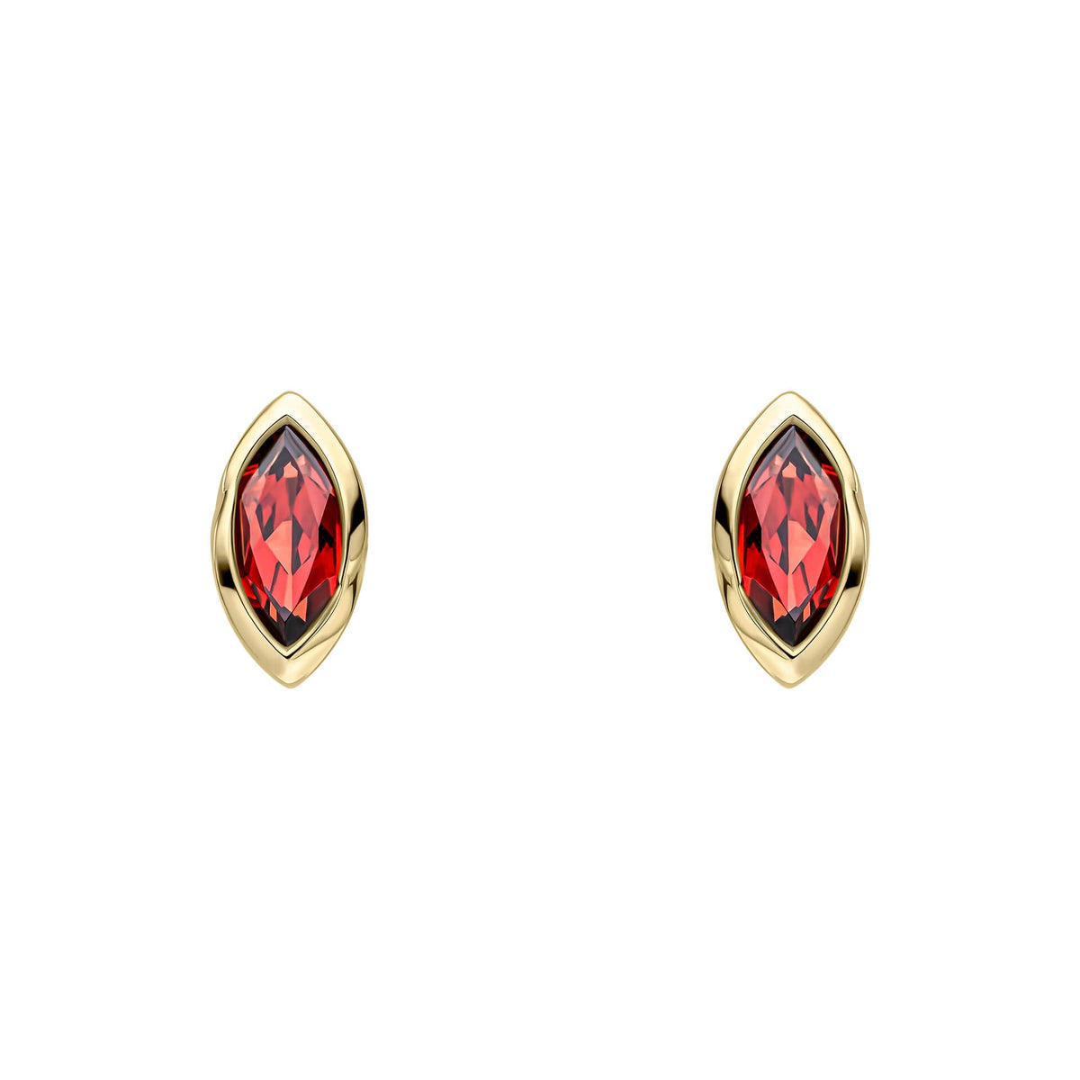 Gold earrings with red gemstones on a white background