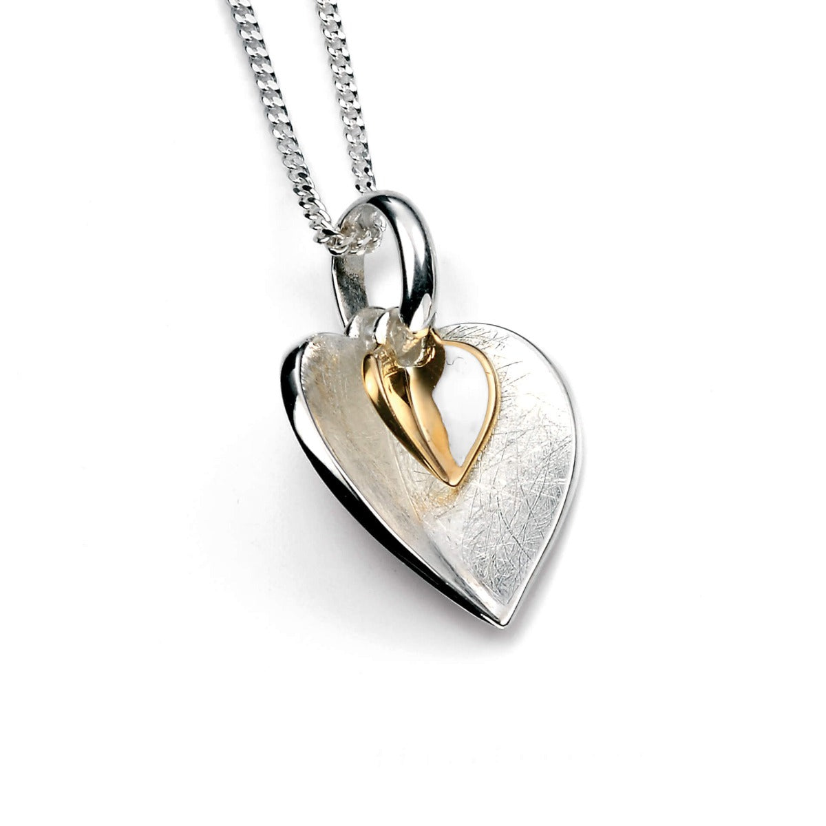 Heart-shaped silver and gold pendant on a white background
