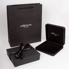Black jewelry box with bow and open lid displaying 'Diamondfire' branding on a white background