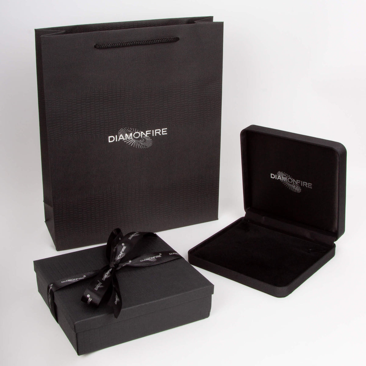 Black jewelry box with bow and open lid displaying 'Diamondfire' branding on a white background